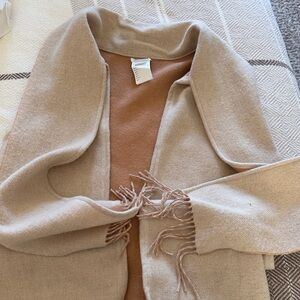 Elegant Beige Women's sweater vest with scarf.